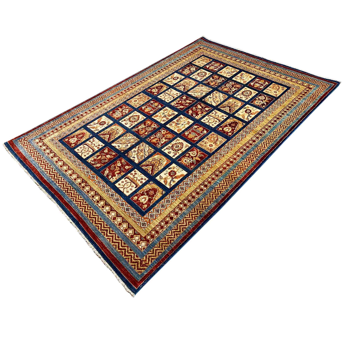 Khorjin rug lying at an angle with a square pattern, multicolored edging, and blue/red borders