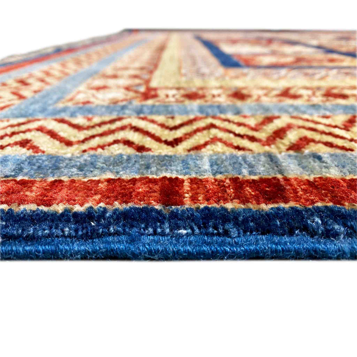 Khorjin rug close-up: colorful border, thick selvedge/pile, dark blue, red, blue, cream-colored