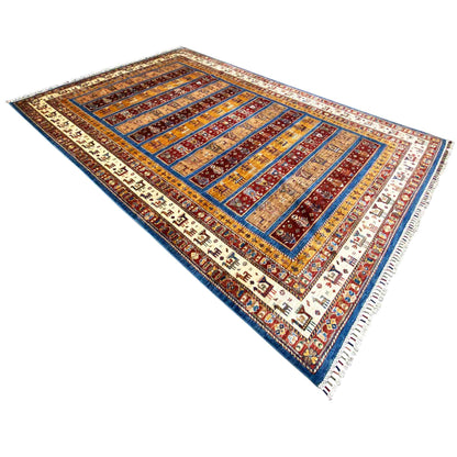 Rug with bold blocks of color and an ornamental border in blue, red, and yellow