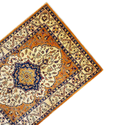 Khorjin rug detail: corner and border with medallion and floral design, orange/blue/cream