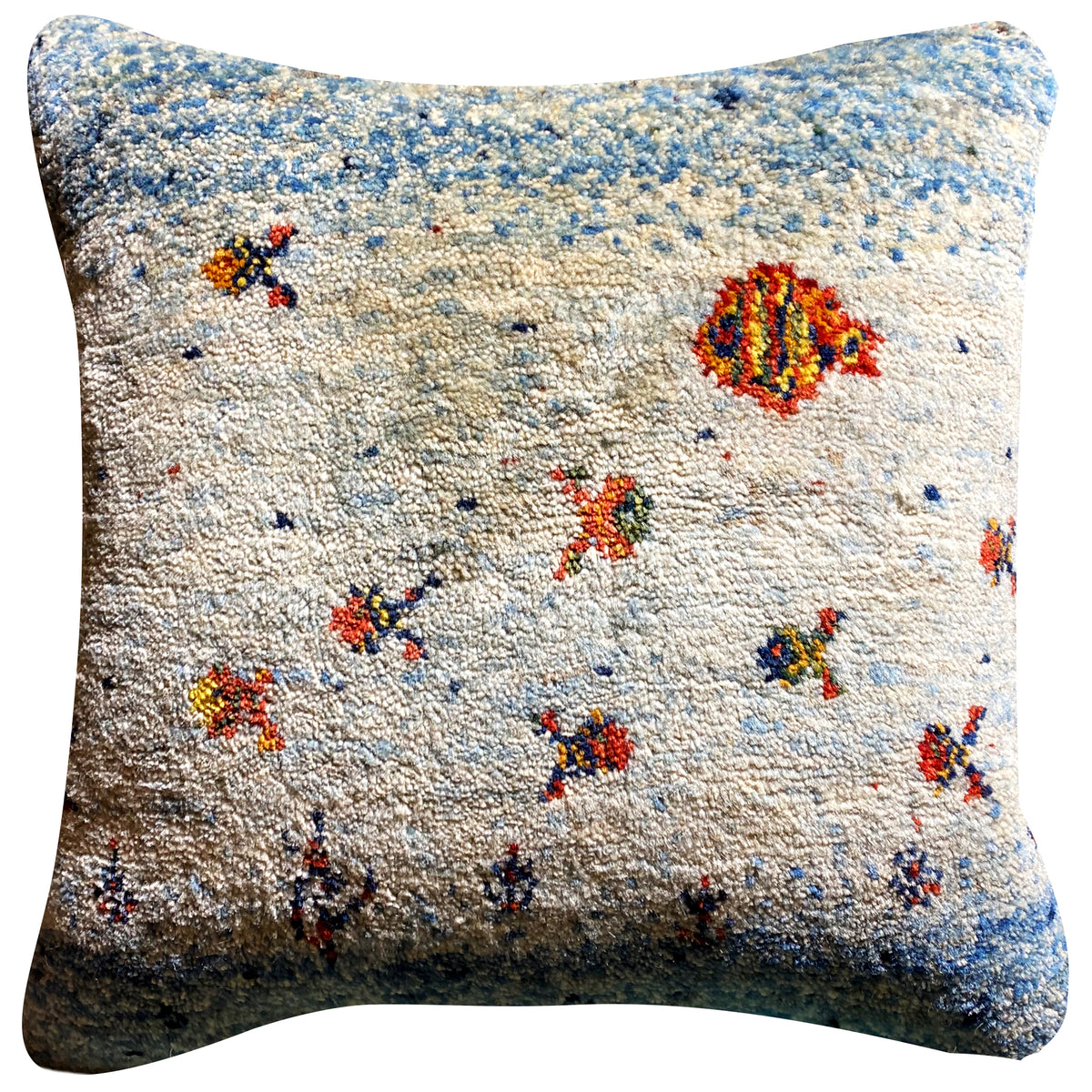 Square cushion with blue-and-white textured fabric and multicolored animal/floral motifs