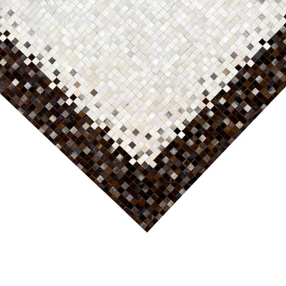 Calfskin rug with a geometric mosaic in a light pattern and dark corner area