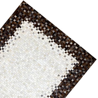 Calfskin rug corner with a white central motif and a brown-black mosaic border