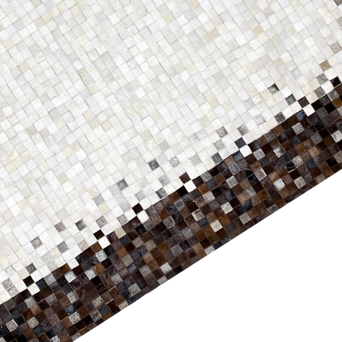 Calfskin rug lengthwise side with a light patterned stripe and brown mosaic border