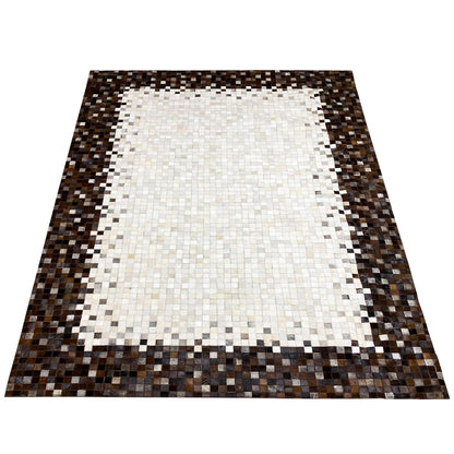 Calfskin rug with a rectangular overall design: light center, dark border frame