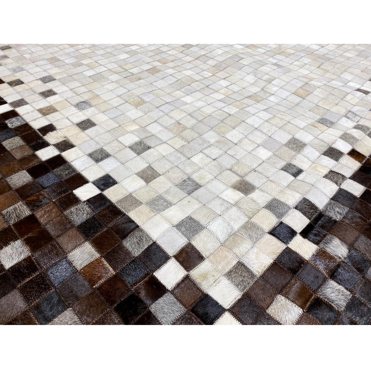 Close-up of a calfskin rug: woven mosaic in light and brown-black squares