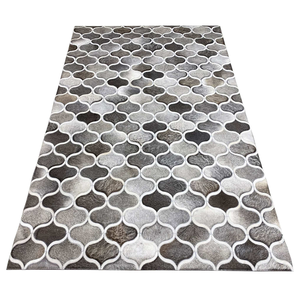 Calfskin rug with a rectangular cut and a gray-and-white grid pattern