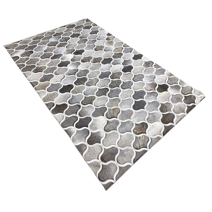 Calfskin rug viewed diagonally, uniform gray and white grid pattern