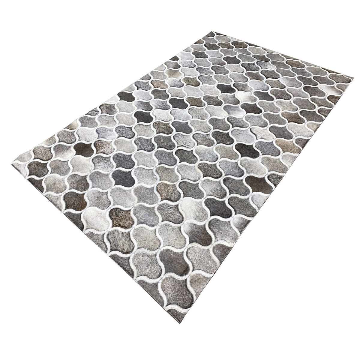 Calfskin rug with a diagonal design, varying shades of gray in a geometric grid