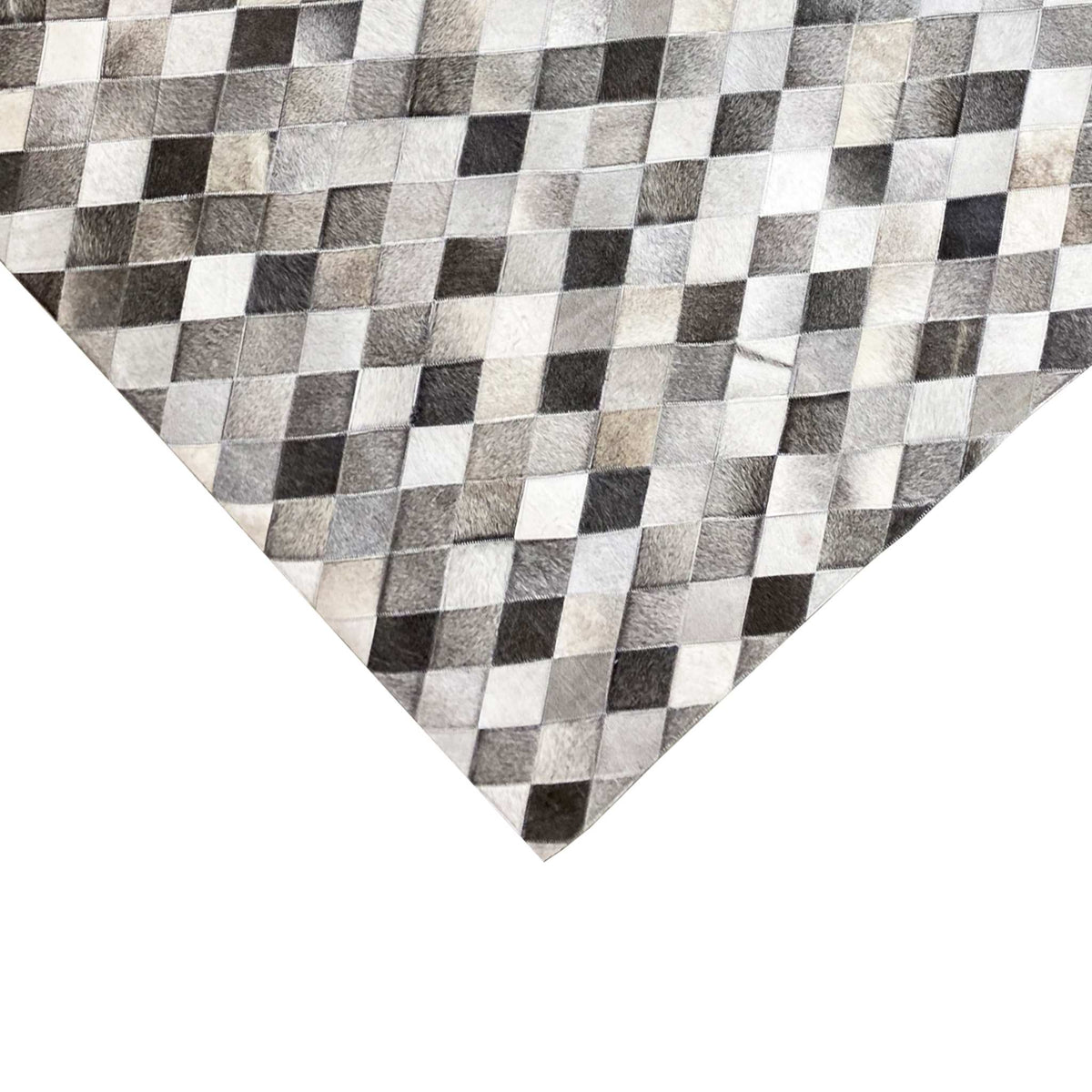 Close-up: diamond pattern in calfskin with a fur texture in gray, black, and white