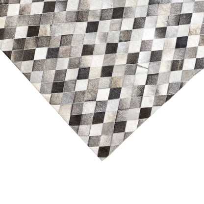 Close-up: diamond pattern in calfskin with a fur texture in gray, black, and white