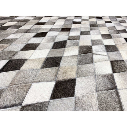 Detail of the leather rug: diamond pattern with fur texture in black, gray, and white