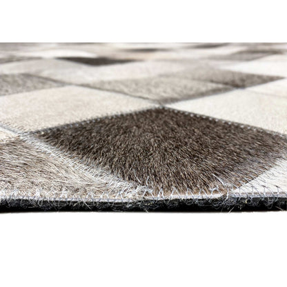 Edge view of the leather rug with fur surface and diamond pattern, black-gray-white
