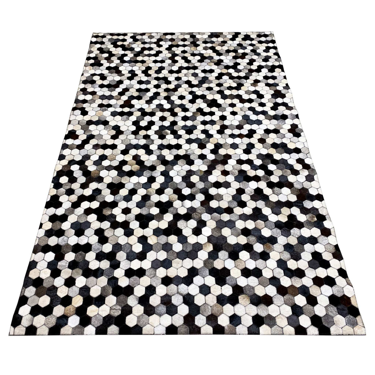 Large calfskin rug with an even hexagon pattern in black, white, and gray