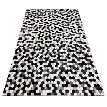Large calfskin rug with an even hexagon pattern in black, white, and gray