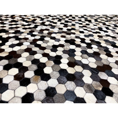 Close-up view of the hexagon pattern on a calfskin rug in black, white, and shades of gray