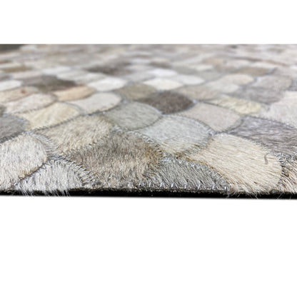 Beige and gray shell calfskin rug with fringed edges and a shell pattern