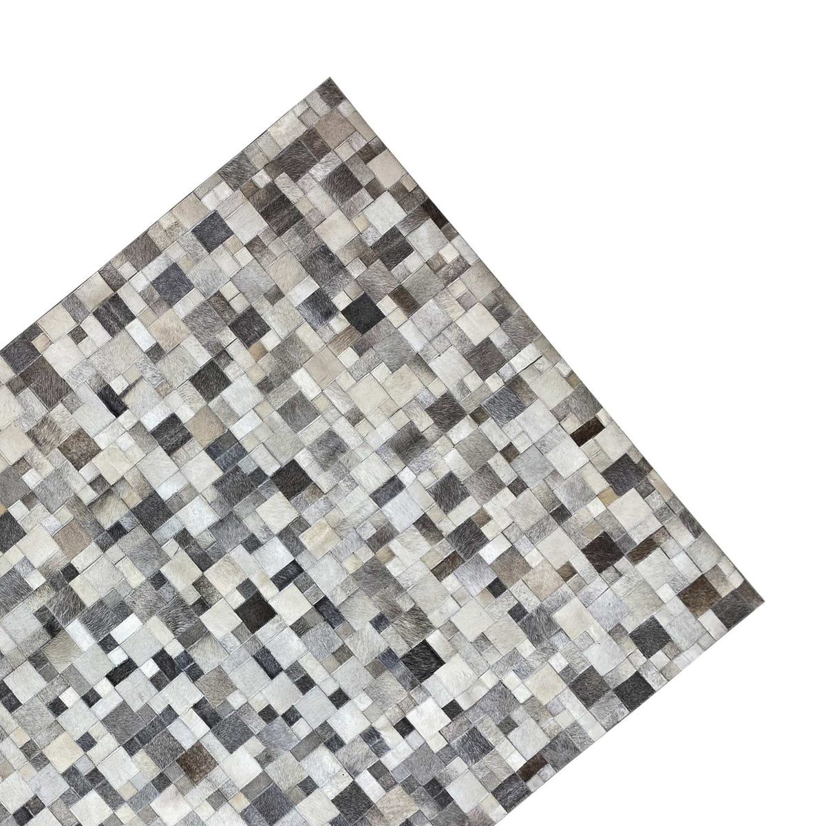 Calfskin rug with a diagonal view, tiled pattern in gray, cream, and black