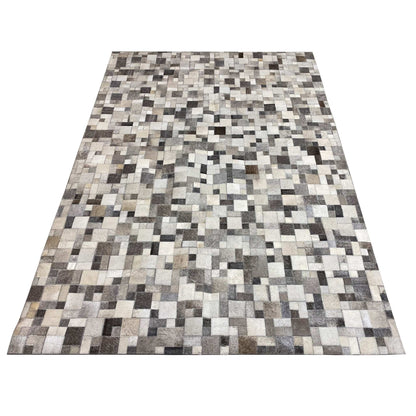 Rectangular calfskin rug with a large-scale tile pattern in gray, cream, and dark brown