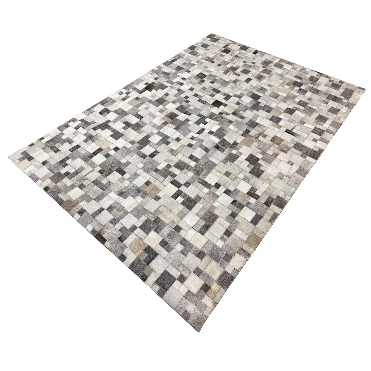 Calfskin rug in an angled perspective, square leather pieces in gray/cream and black