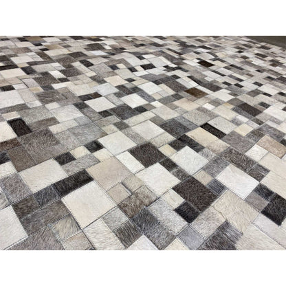 Close-up of a calfskin rug: glossy leather texture with high-contrast tiled squares