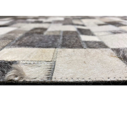 Calfskin rug detail at the edge with short pile and visible seam/cut edges
