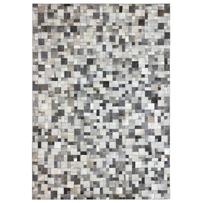 Calfskin rug with a geometric tile pattern in gray, cream, and black, square