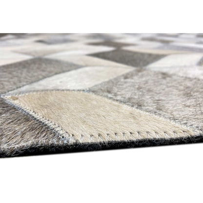 Rug edge with contrasting stitching and a short, dense pile surface