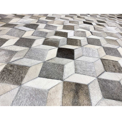 Calfskin rug with a 3D cube pattern, textured in gray, white, and black