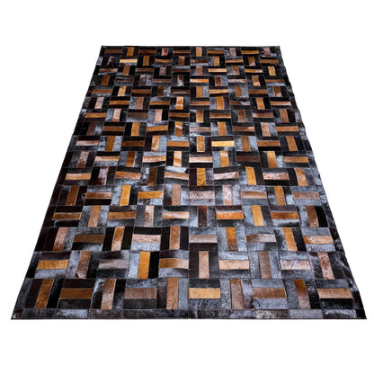 Wide leather rug with a geometric brick pattern in black, gray, and ochre