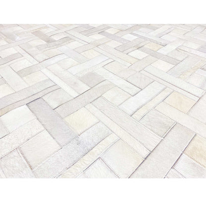 Woven leather rug with a brick pattern in light gray and white tones