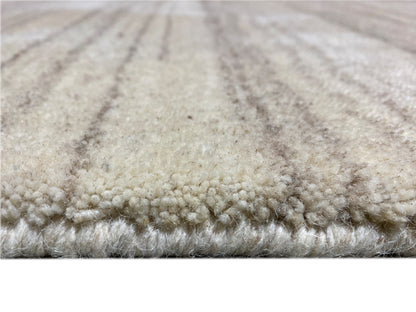 Carpet surface with a short pile and beige, mottled stripes