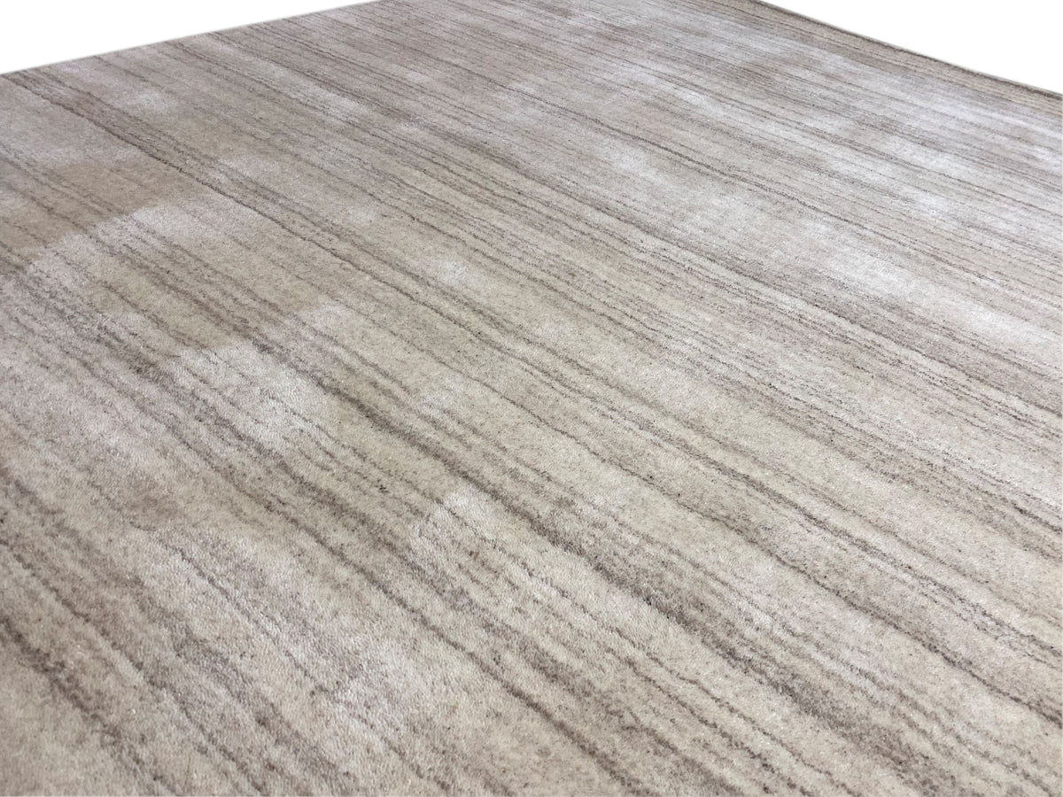 Rug with a beige base and a muted stripe pattern, uniform appearance