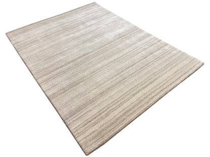 Light beige rug with a subtle striped pattern, laid flat