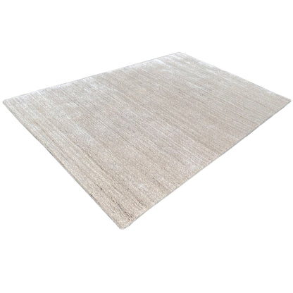 Beige carpet at an oblique angle; even, textured surface