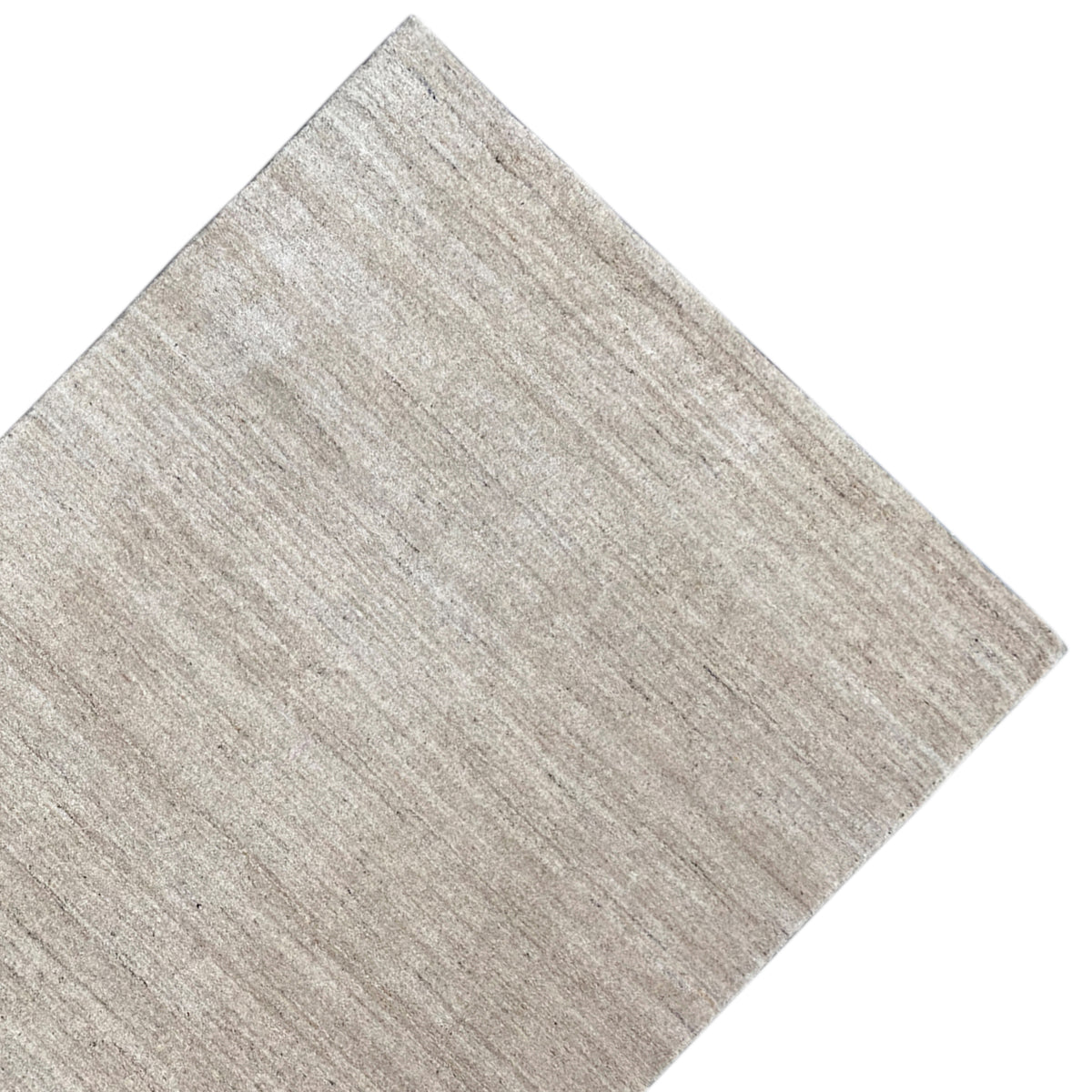 Beige carpet with a vertical microtexture and an angled side view