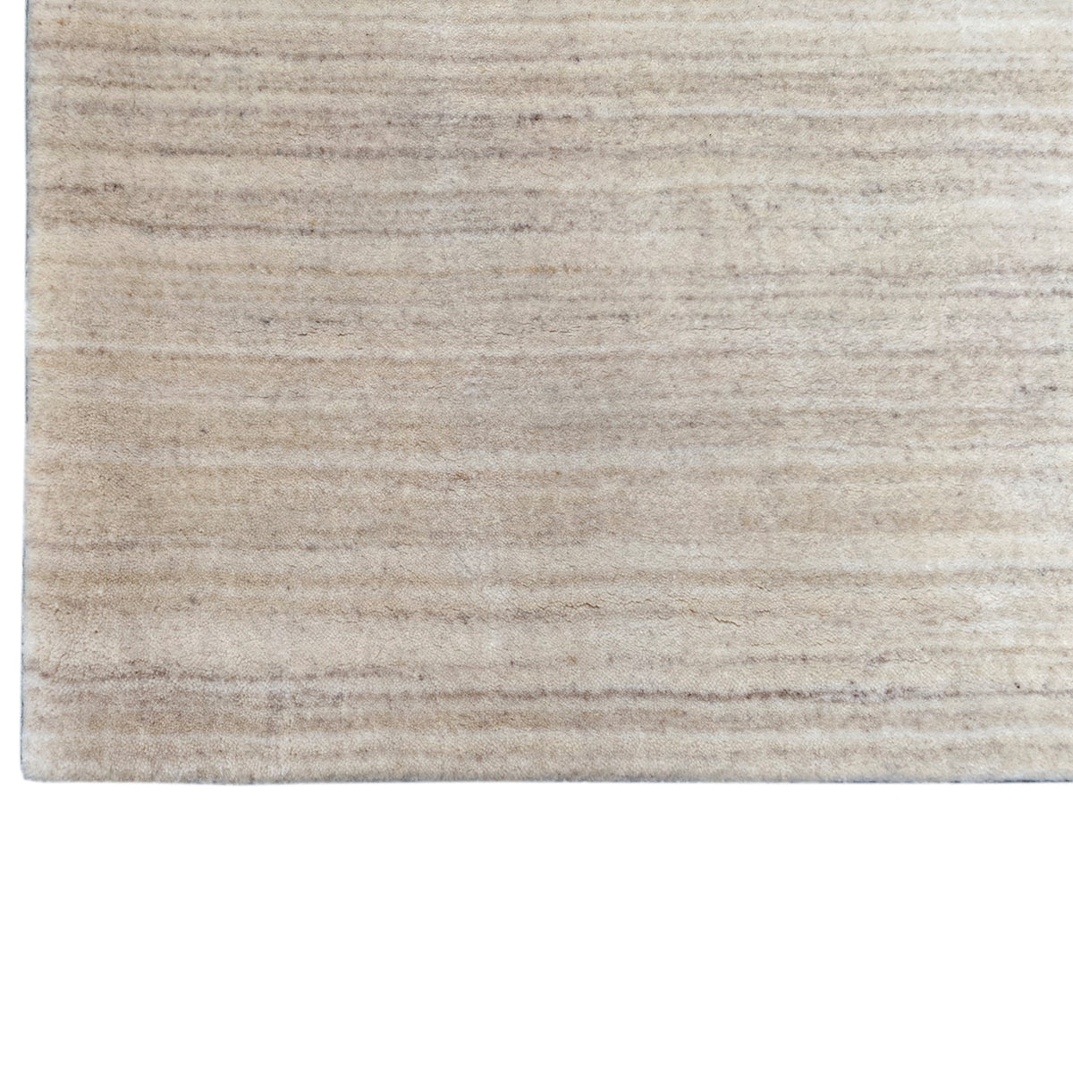 Natural gabbeh rug, close-up, light beige with a horizontal line pattern