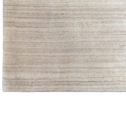 Natural gabbeh rug, close-up, light beige with a horizontal line pattern
