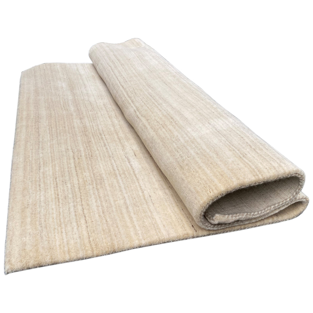 Natural gabbeh rug, rolled in two layers, light beige, pile and underside visible