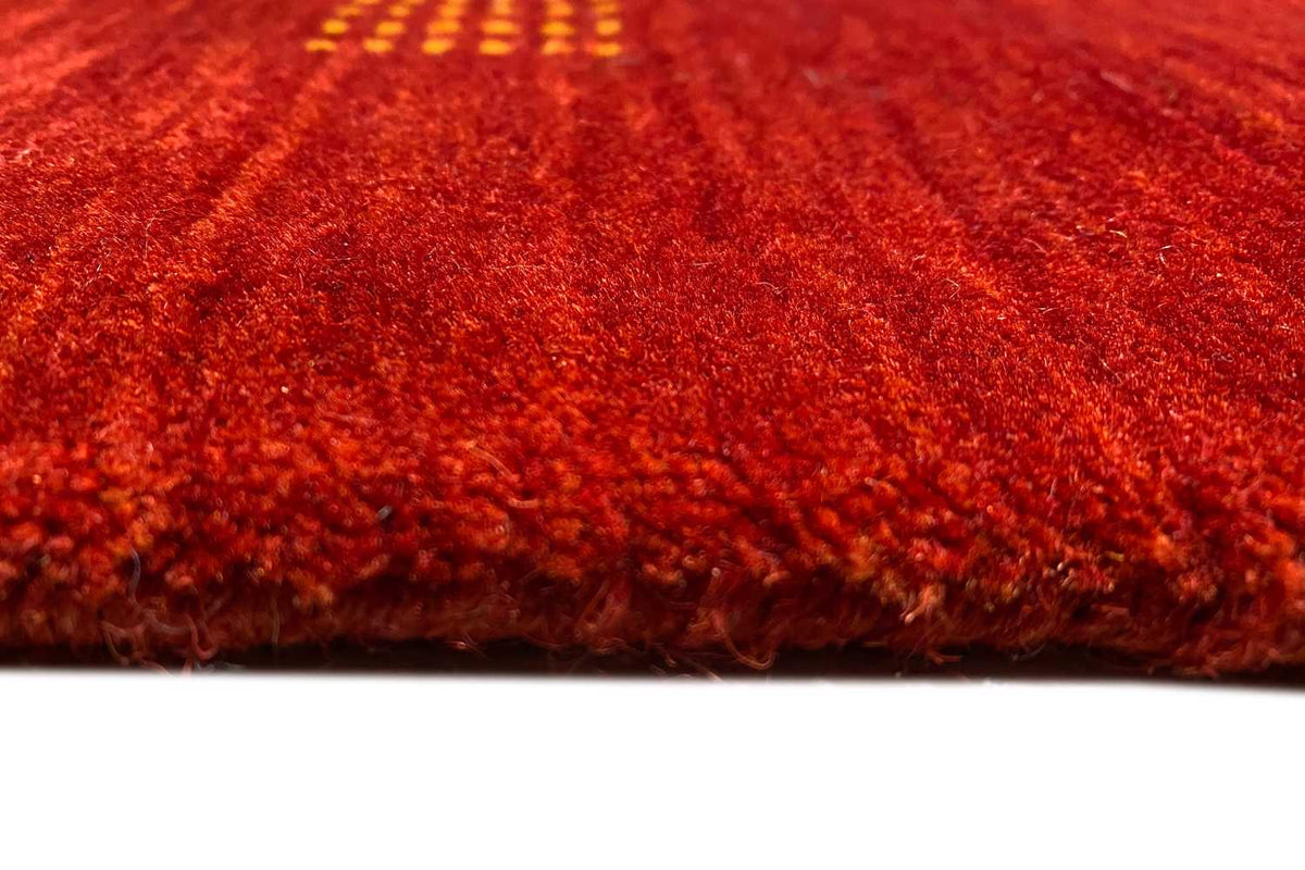 Carpet edge and pile: red carpet with a visible woven texture along the edge