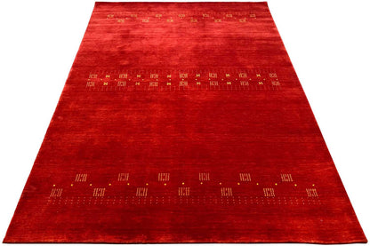 Red carpet with a narrow patterned border and a wide patterned area