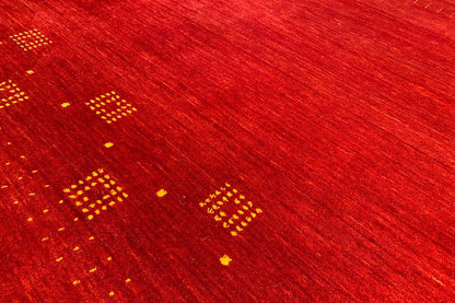 Red carpet with gold dot and diamond motifs, fine woven texture