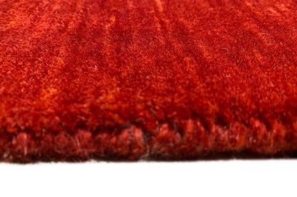 Red carpet border with a short fringe trim and dense pile surface