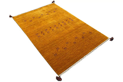 Gabbeh-style rug with a diamond pattern and tassels at all four corners