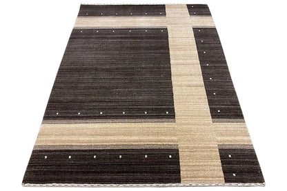 Carpet in triangular view: wide dark central band, beige stripe, and small light dots
