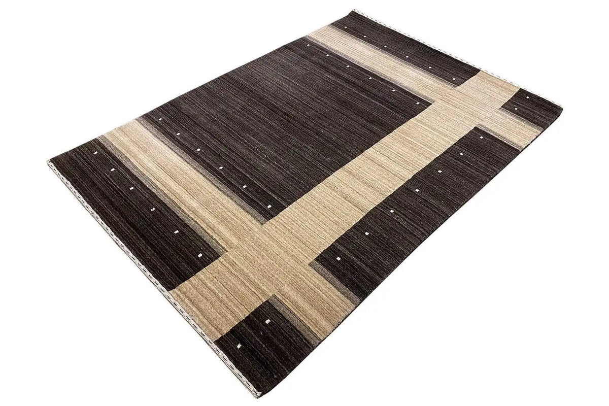 Rug in the corner: dark grid pattern with beige bars and scattered light dots