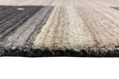 Carpet pile in close-up detail with a frayed edge; light strip and dark contrasting stripes