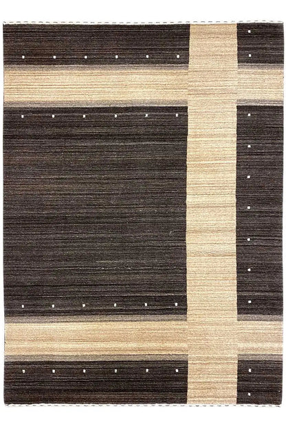 Rectangular rug with a framed pattern of dark and beige areas with dot accents