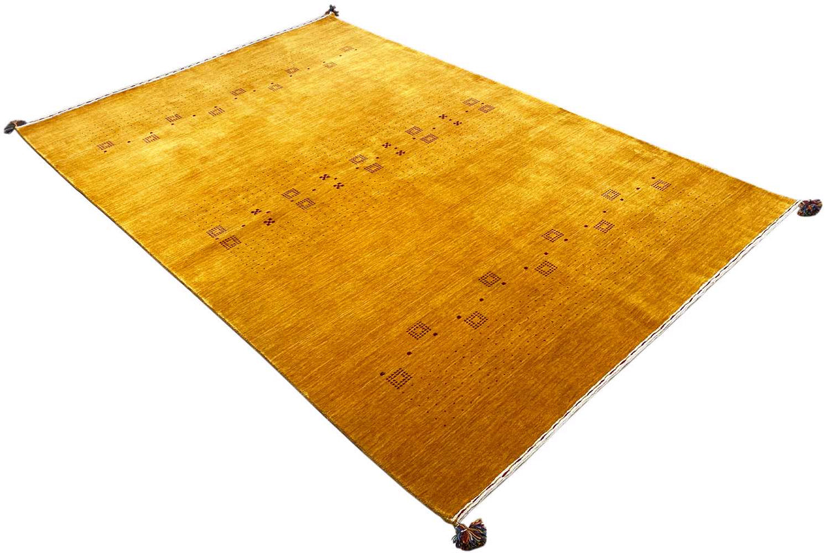 Honey-brown Gabbeh rug, spread out diagonally, with a square ornament