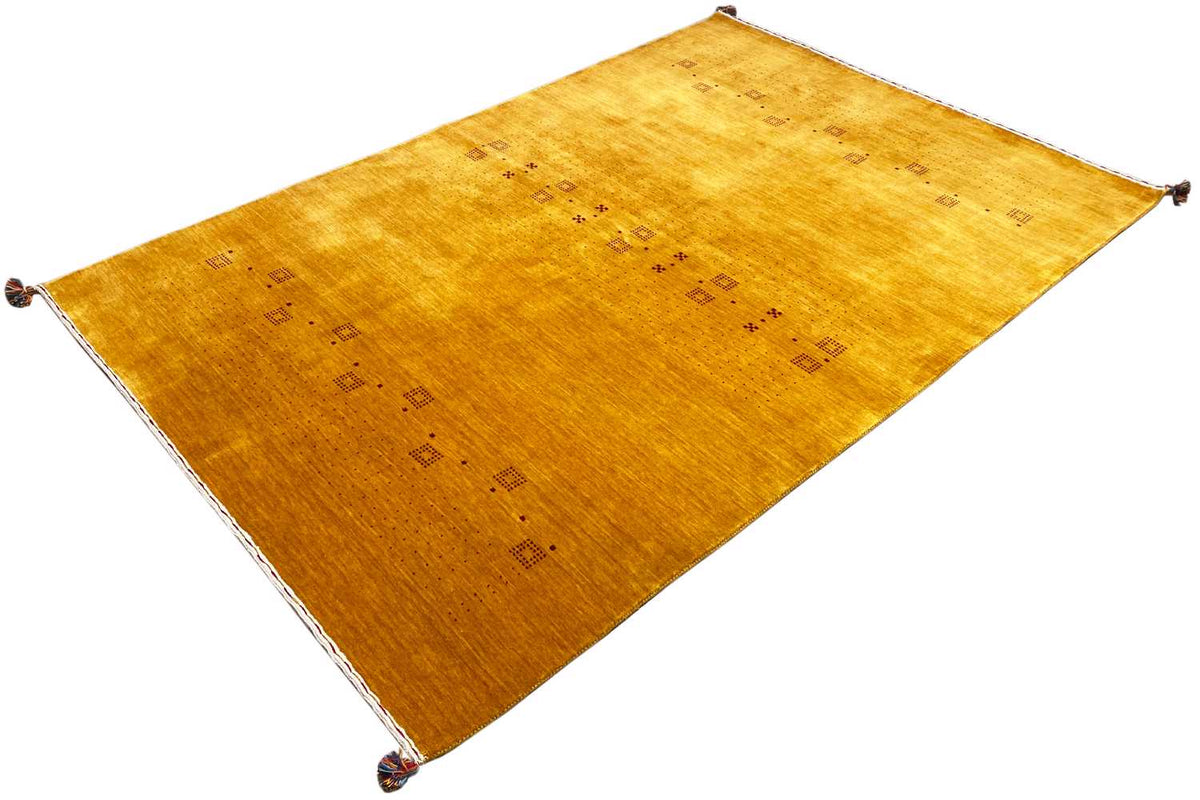Honey-brown Gabbeh rug with a delicate geometric pattern and fringes at all corners